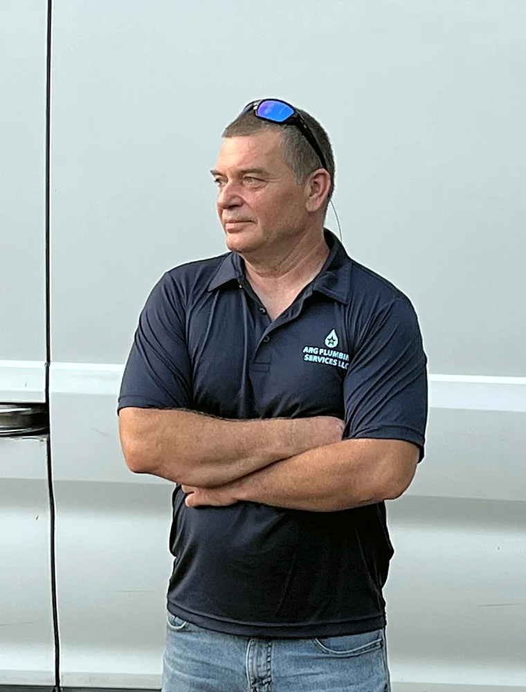 Hristo Panov, Licensed Master Plumber, in front of the ARG Plumbing service van